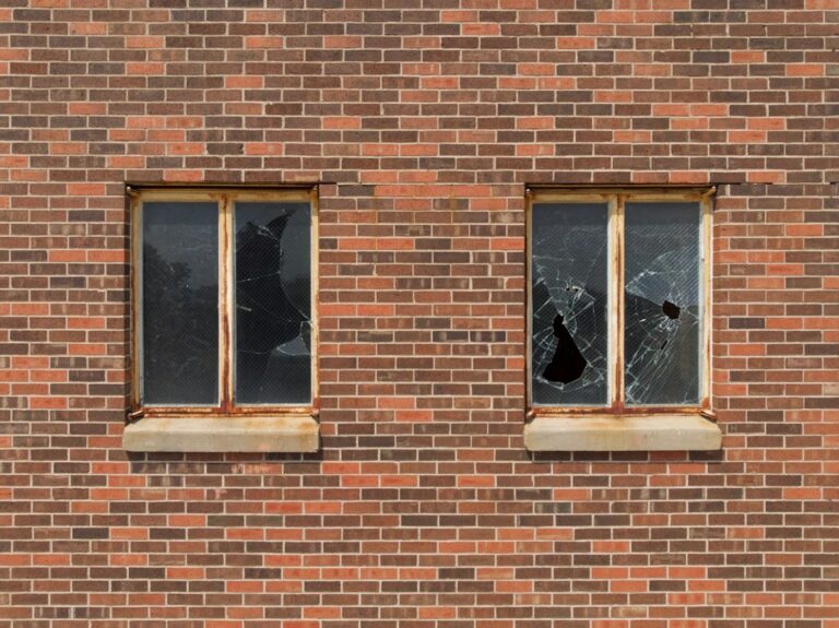 Broken windows in an apartment building