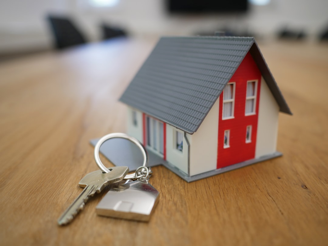 House keys beside rental agreement and insurance documents