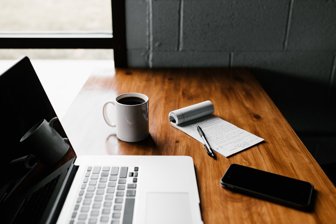 Laptop and personal electronics on a desk
